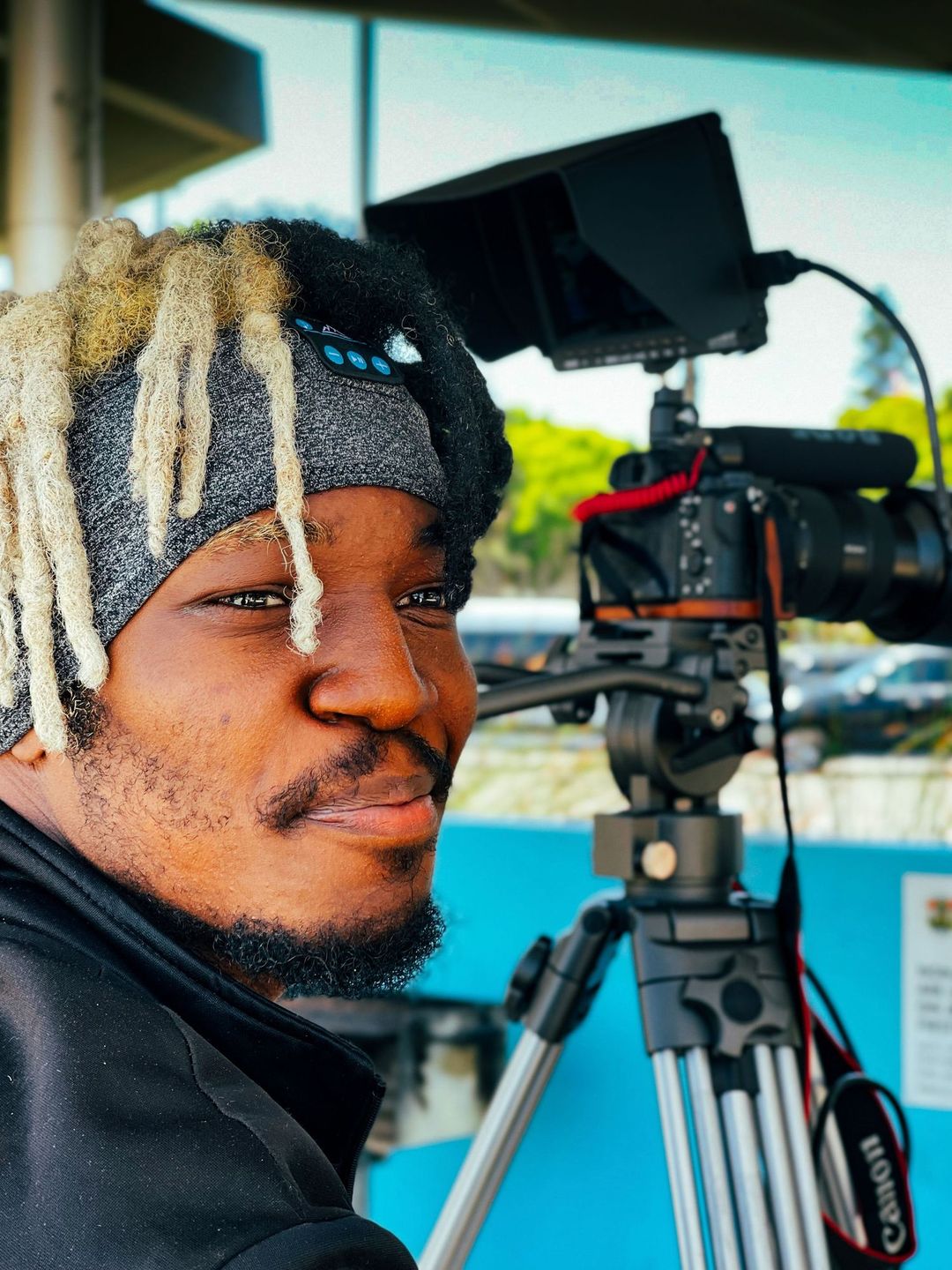 Camera operator with a cinema rig checking the frame