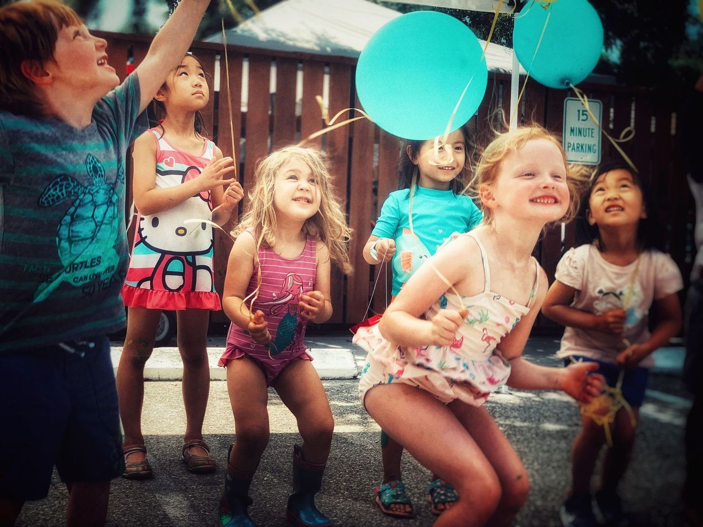 Children with a balloon in a vintage-toned scene