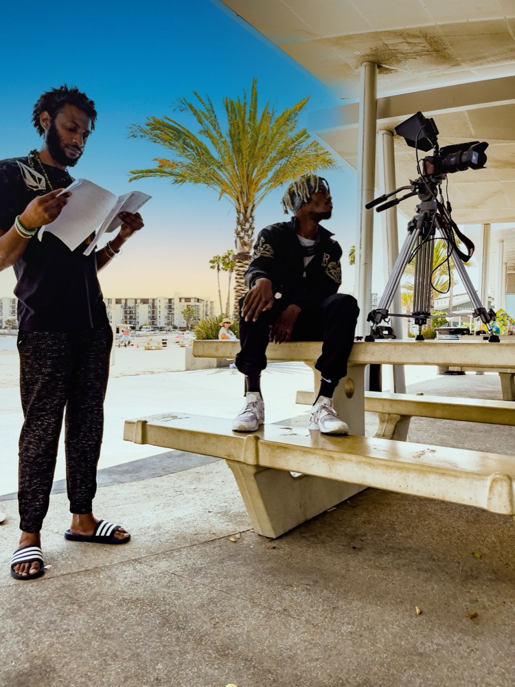 Behind the scenes of a portrait session beside a palm tree